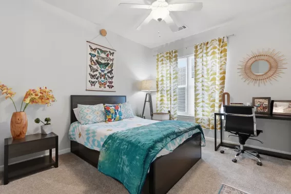 Apartment bedroom with bed and nightstands