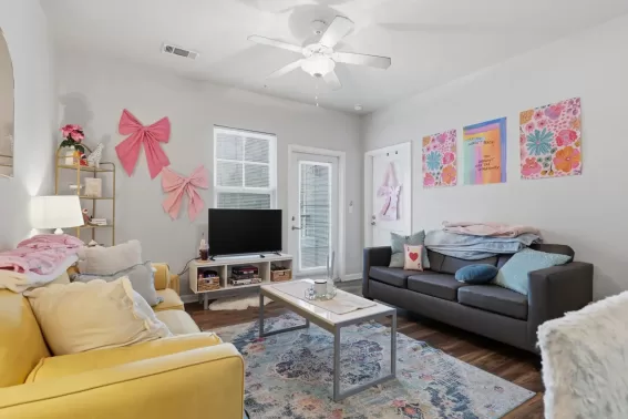 Apartment living area with sofa and chairs