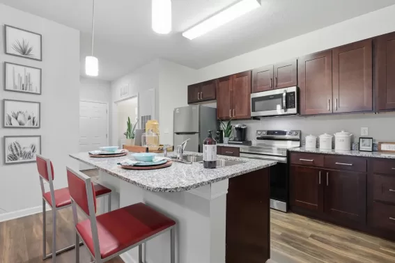 Apartment kitchen with appliances and countertops